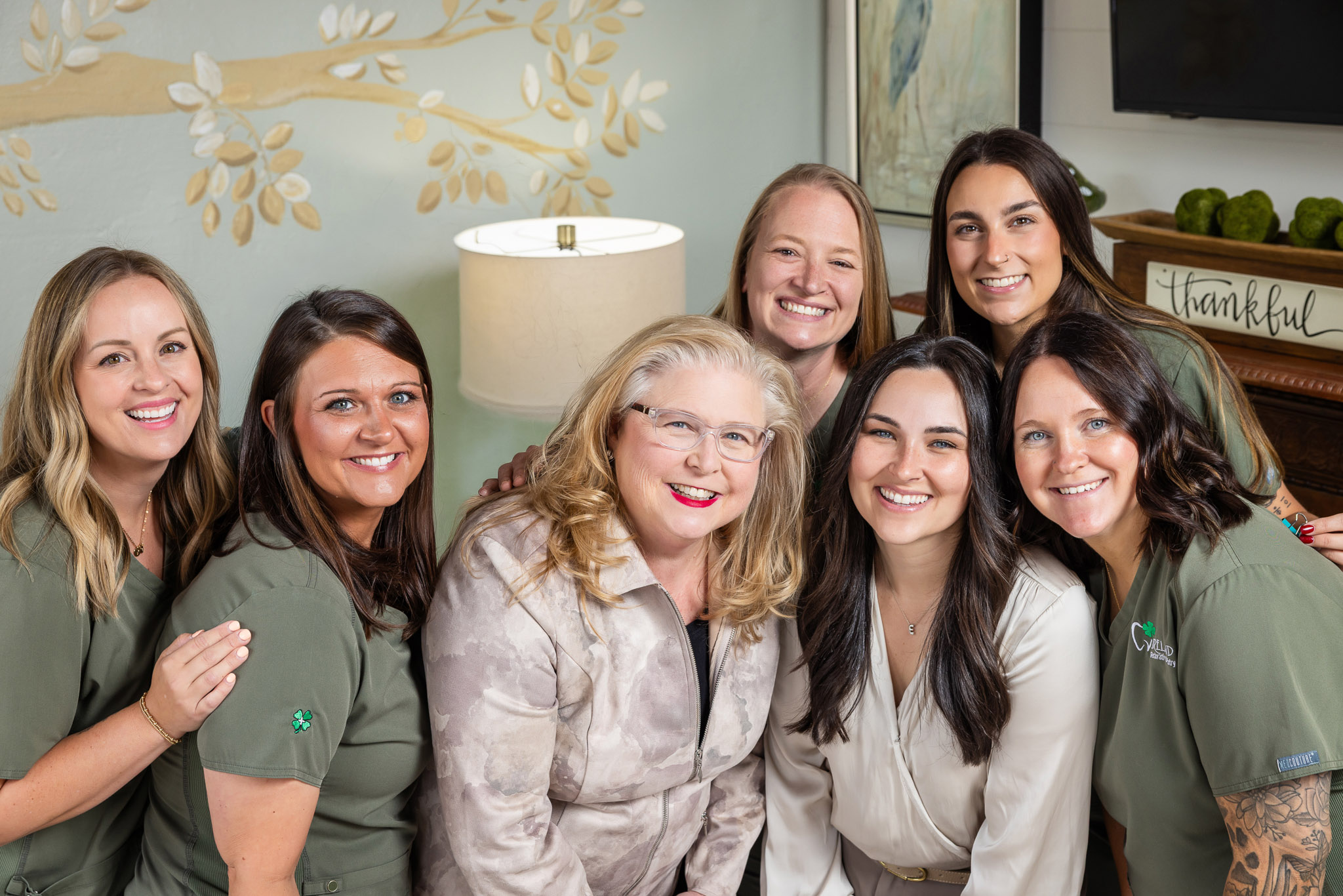 The Ireland Restorative Dentistry team smiling together in a warm, welcoming group portrait
